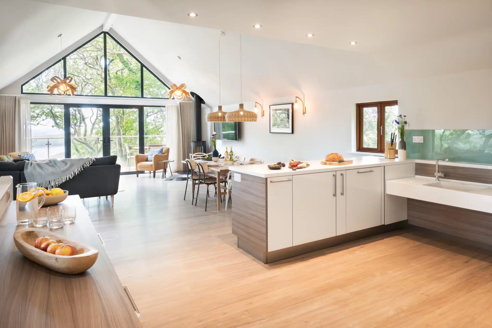 Bright kitchen and living space with freshly decorated walls and woodwork