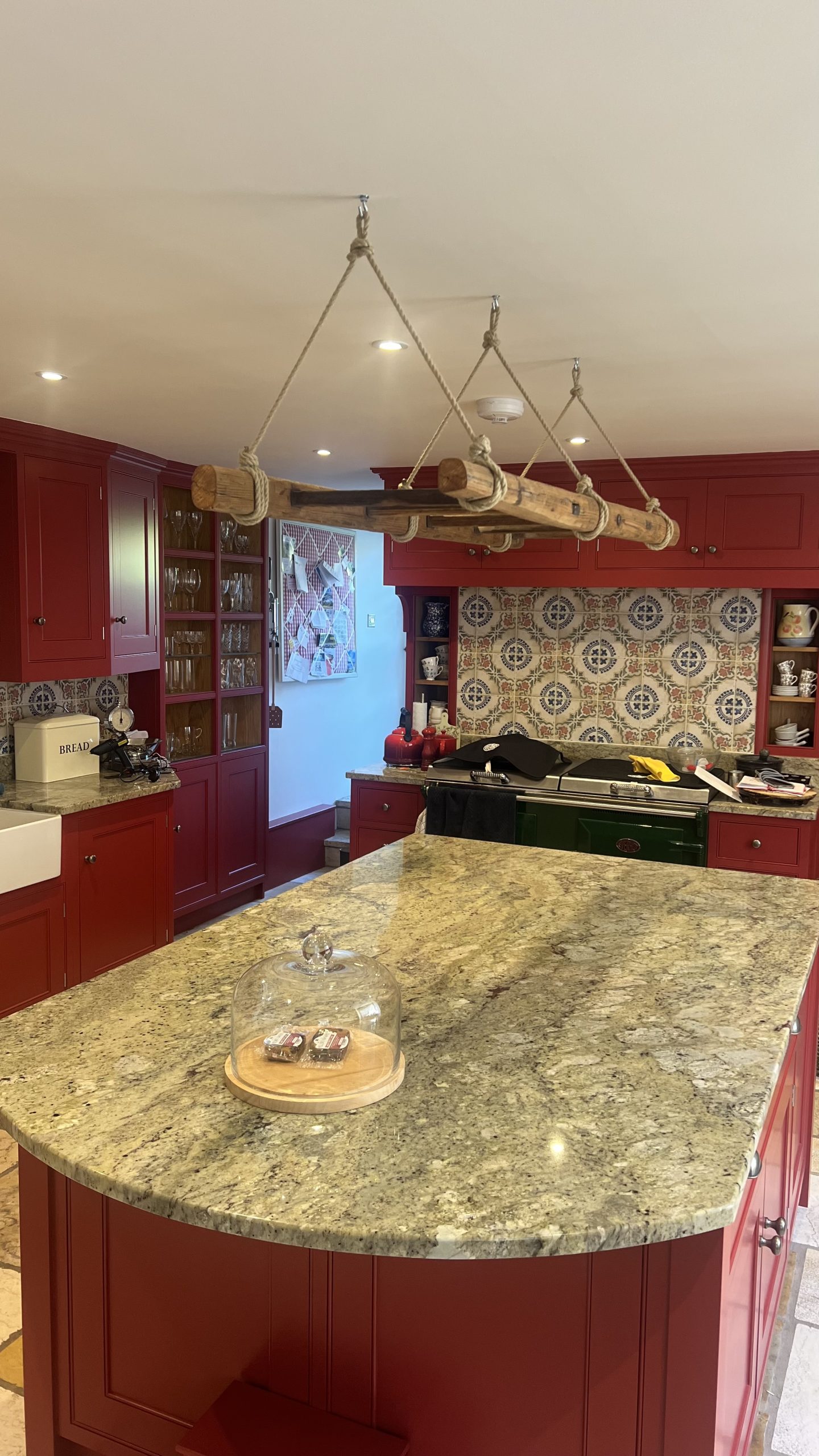 Kitchen units painted in Farrow & Ball. Hung a vintage French library ladder from the ceiling.